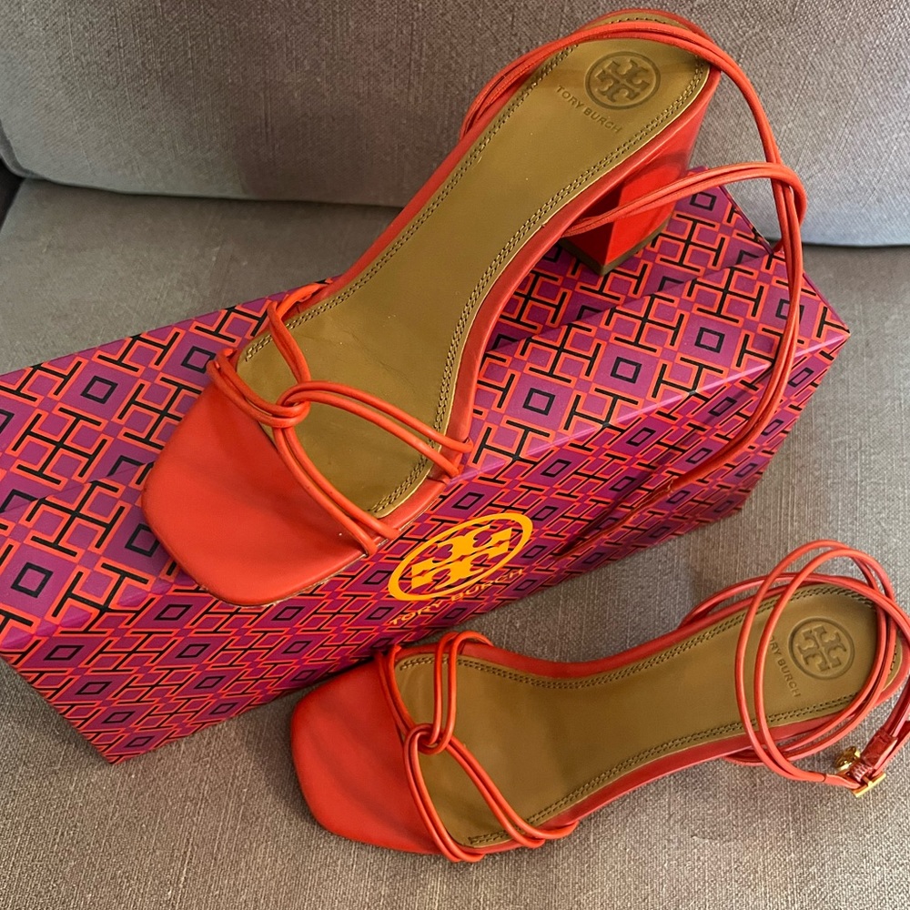 TORY BURCH Red leather heel sandals with TB charm.